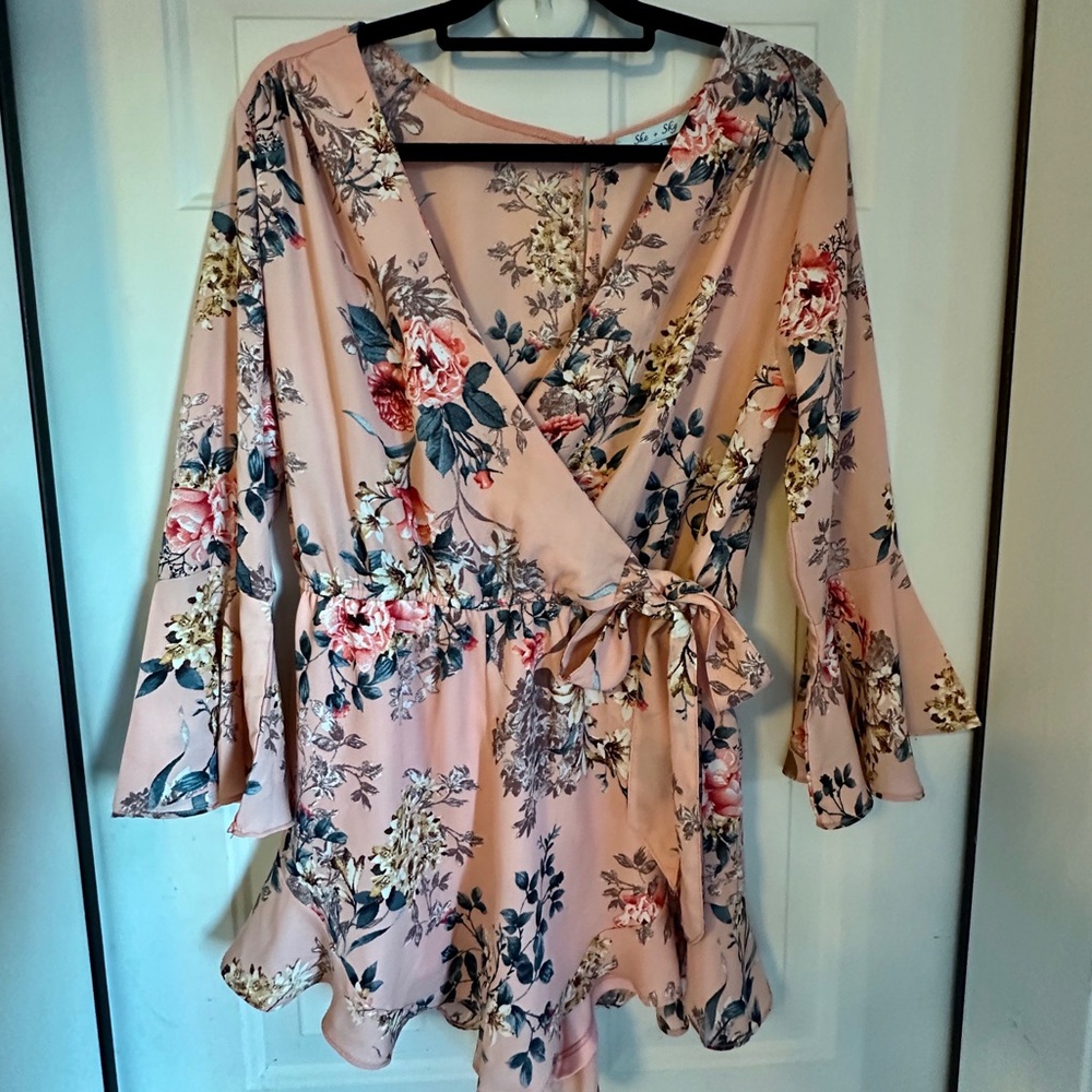 NWOT She + Sky Floral Wrap Style Romper lined, 3/4 sleeve. Size M